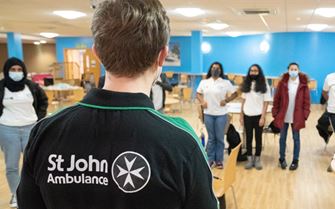 Youth Leader talking to NHS Cadets